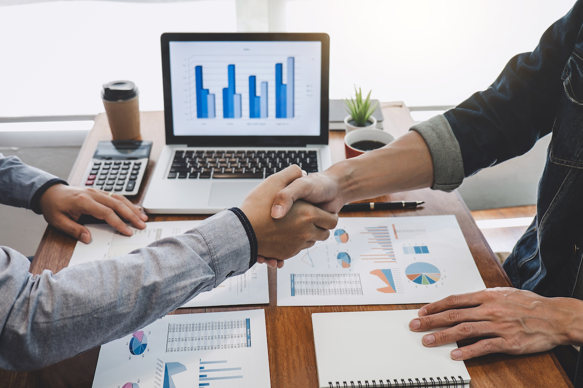 Business partners shaking hands